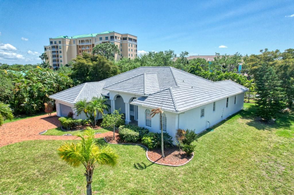 3267 Sugarloaf Key Road Punta Gorda, FL 33955 - Photo 56 of 83 a aerial view of a house next to a big yard and large trees