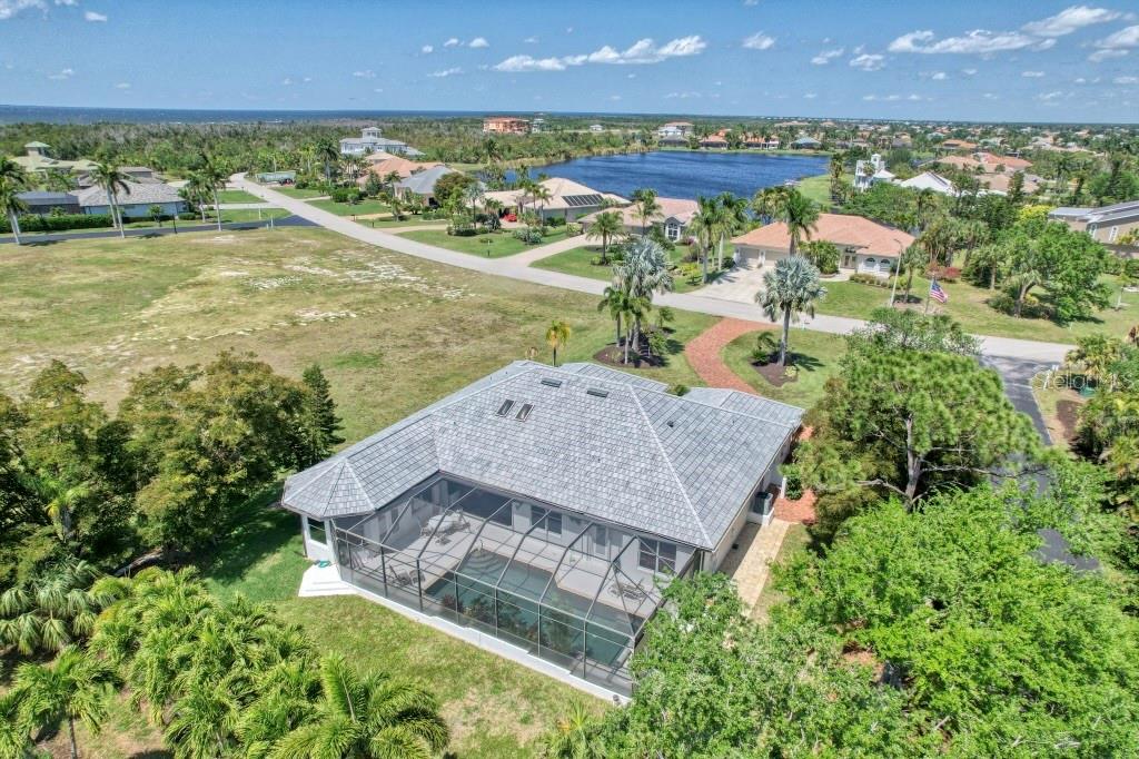 3267 Sugarloaf Key Road Punta Gorda, FL 33955 - Photo 59 of 83 an aerial view of a house with a garden and lake view