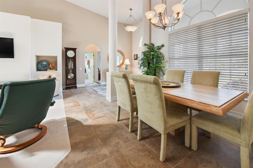 3267 Sugarloaf Key Road Punta Gorda, FL 33955 - Photo 9 of 83 a view of a dining room with furniture and chandelier