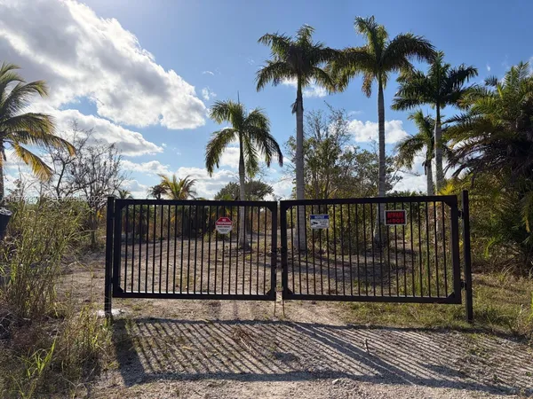 a view of a wrought iron fences in front of house