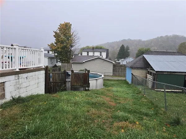 a view of a house with a back yard