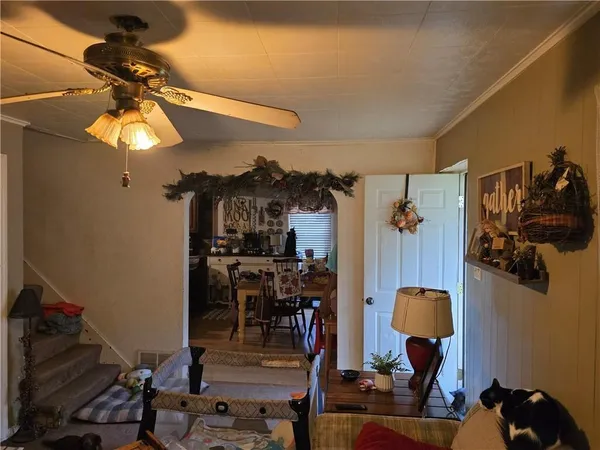 a view of a dining room with furniture and chandelier
