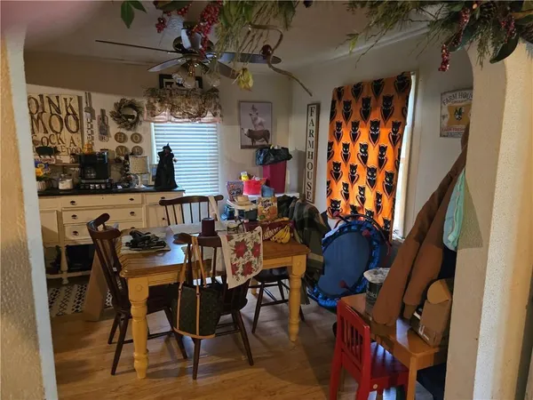 a kitchen with a sink a stove and chairs