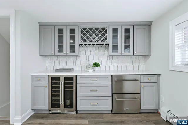 a kitchen with stainless steel appliances granite countertop a stove and a refrigerator