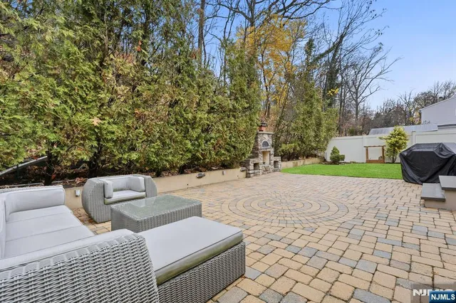 a view of backyard with a table and chairs