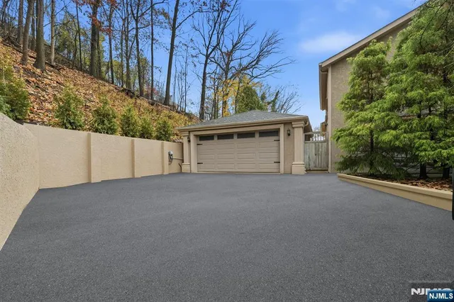 a view of a house with a yard and garage