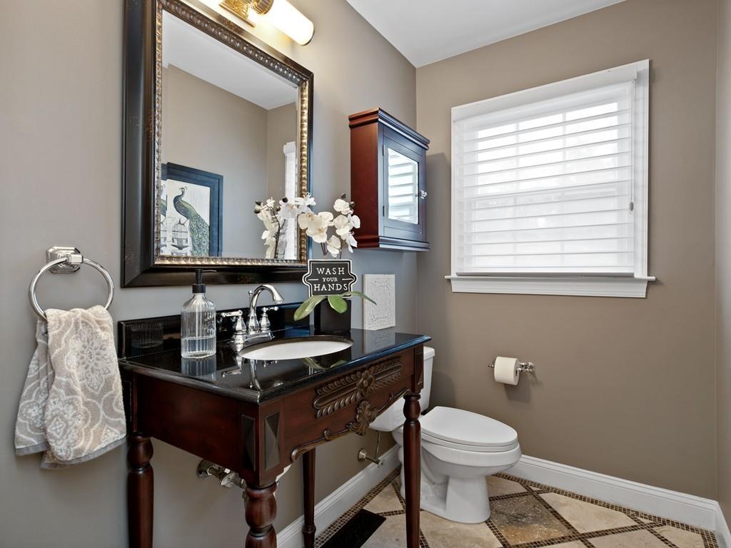 31 Greenwood Road Hopkinton, MA 01748 - Photo 15 of 27 a bathroom with a toilet sink and mirror