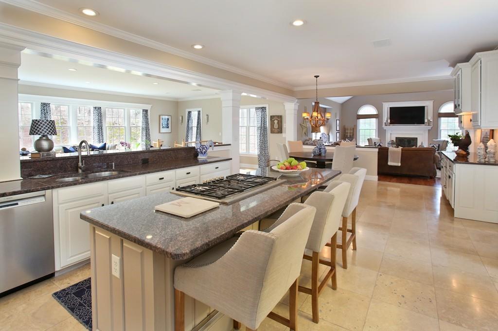 31 Greenwood Road Hopkinton, MA 01748 - Photo 3 of 27 a kitchen with a dining table and chairs