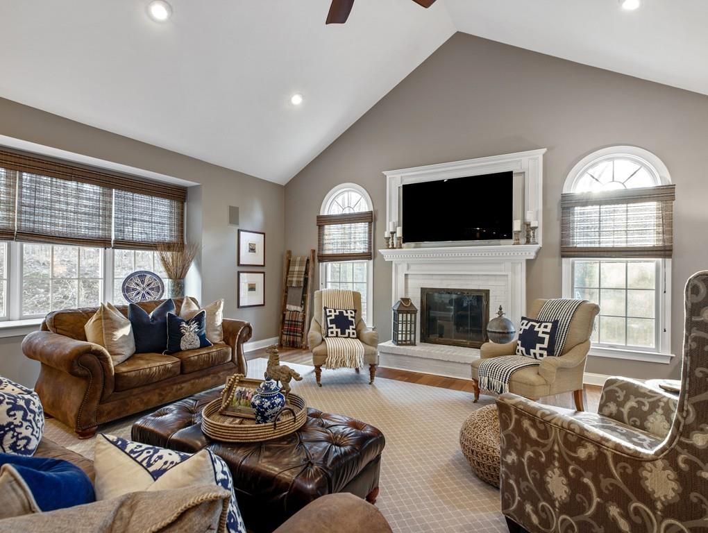 31 Greenwood Road Hopkinton, MA 01748 - Photo 9 of 27 a living room with fireplace furniture and a flat screen tv