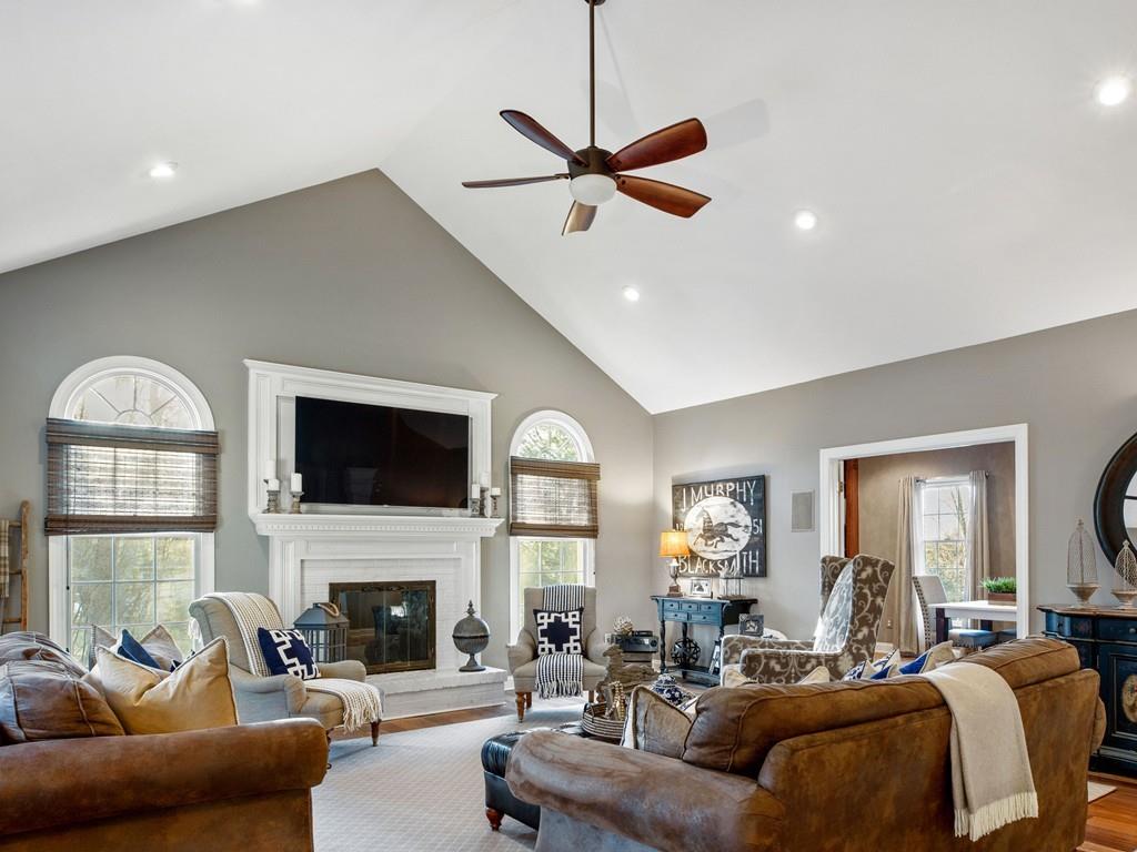 31 Greenwood Road Hopkinton, MA 01748 - Photo 10 of 27 a living room with furniture a fireplace and a flat screen tv