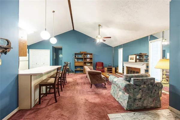 a living room with furniture a table and chairs