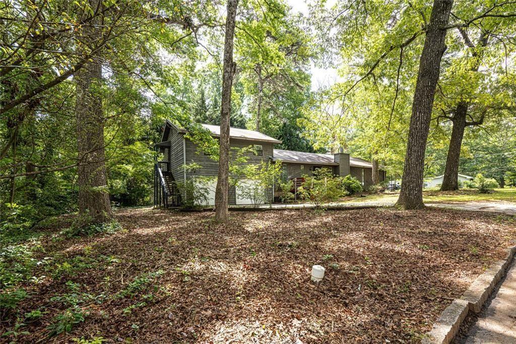 633 Iris Road Pine Lake, GA 30072 - Photo 2 of 39 a view of a yard with plants and trees