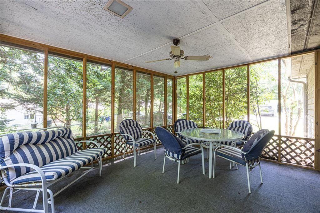 633 Iris Road Pine Lake, GA 30072 - Photo 22 of 39 a view of a dining room with furniture window and outside view