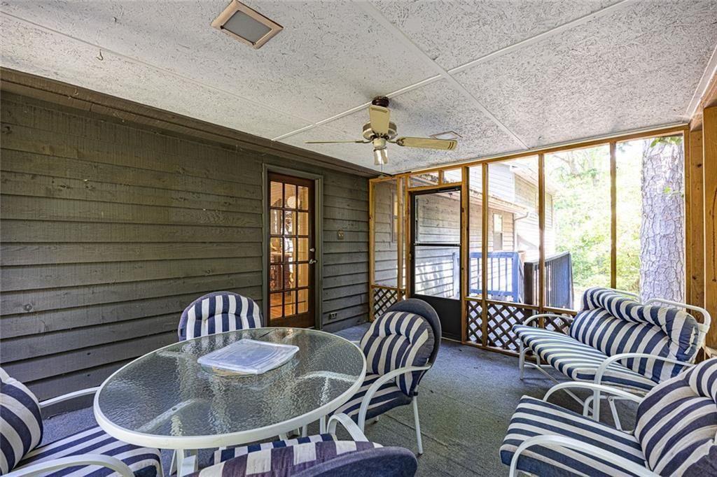 633 Iris Road Pine Lake, GA 30072 - Photo 23 of 39 a view of a dining room with furniture window and outside view