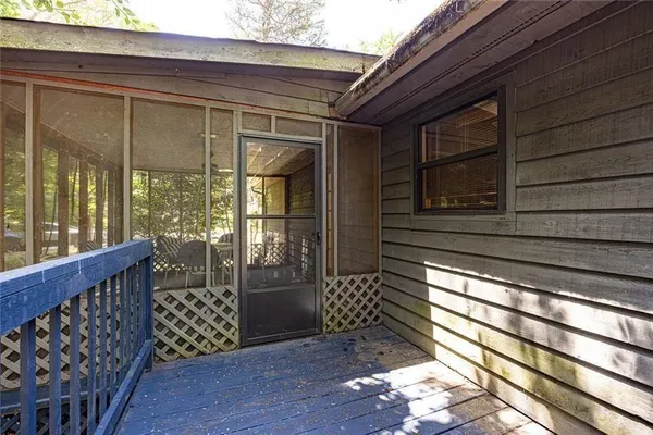 a view of a porch with wooden floor