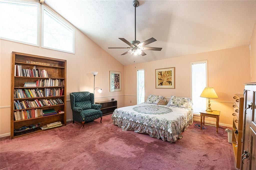 633 Iris Road Pine Lake, GA 30072 - Photo 30 of 39 a bedroom with a bed furniture and a window