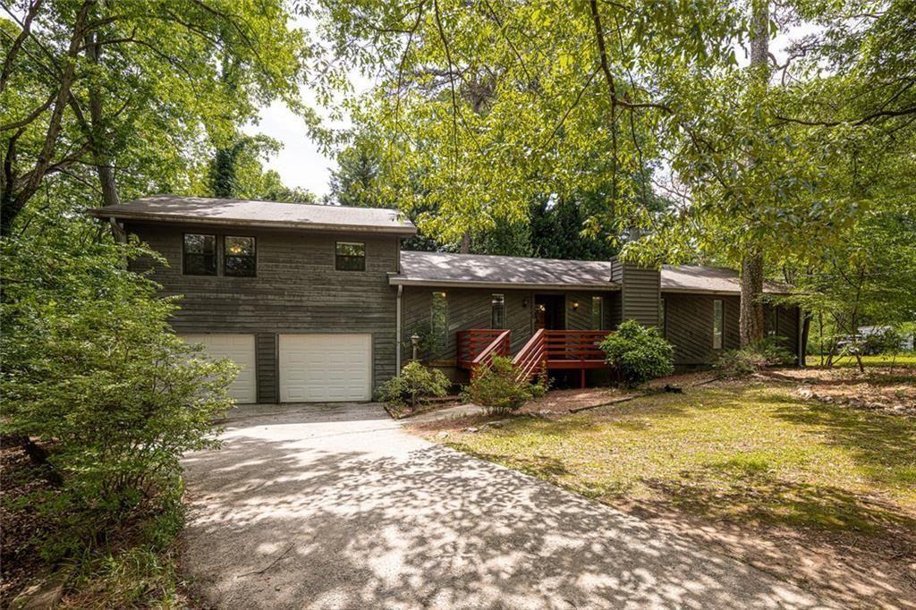 633 Iris Road Pine Lake, GA 30072 - Photo 3 of 39 a view of a house with a patio