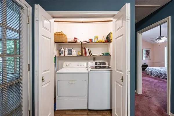a view of a kitchen with storage and utility