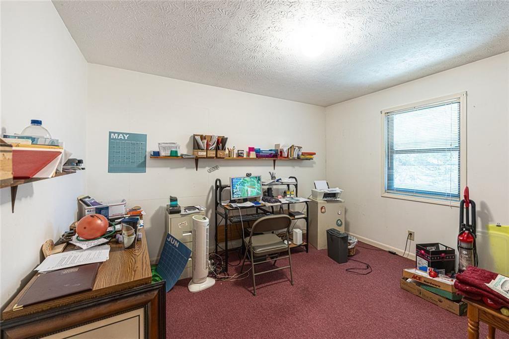 633 Iris Road Pine Lake, GA 30072 - Photo 39 of 39 a room with furniture and a window