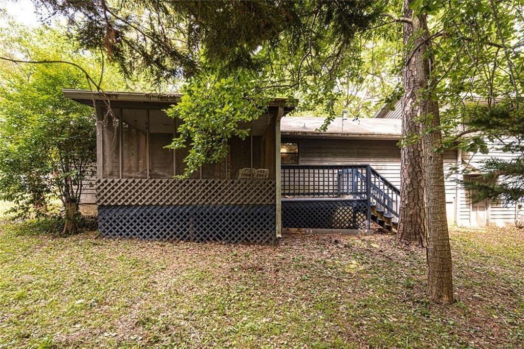 633 Iris Road Pine Lake, GA 30072 - Photo 5 of 39 a view of a wooden door and trees
