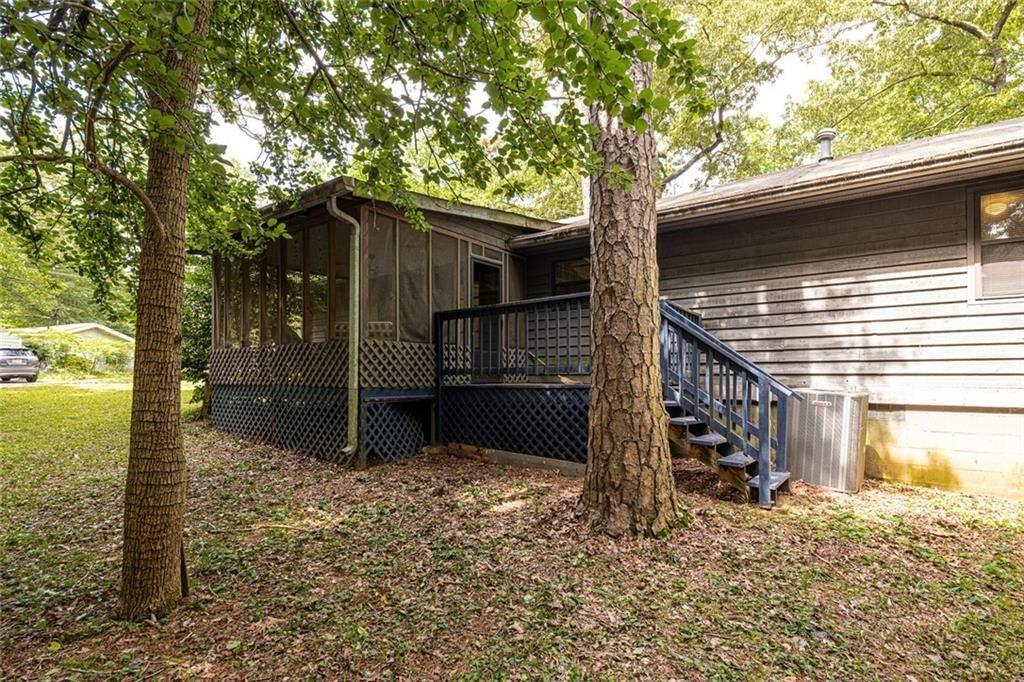 633 Iris Road Pine Lake, GA 30072 - Photo 6 of 39 a house with trees in front of it