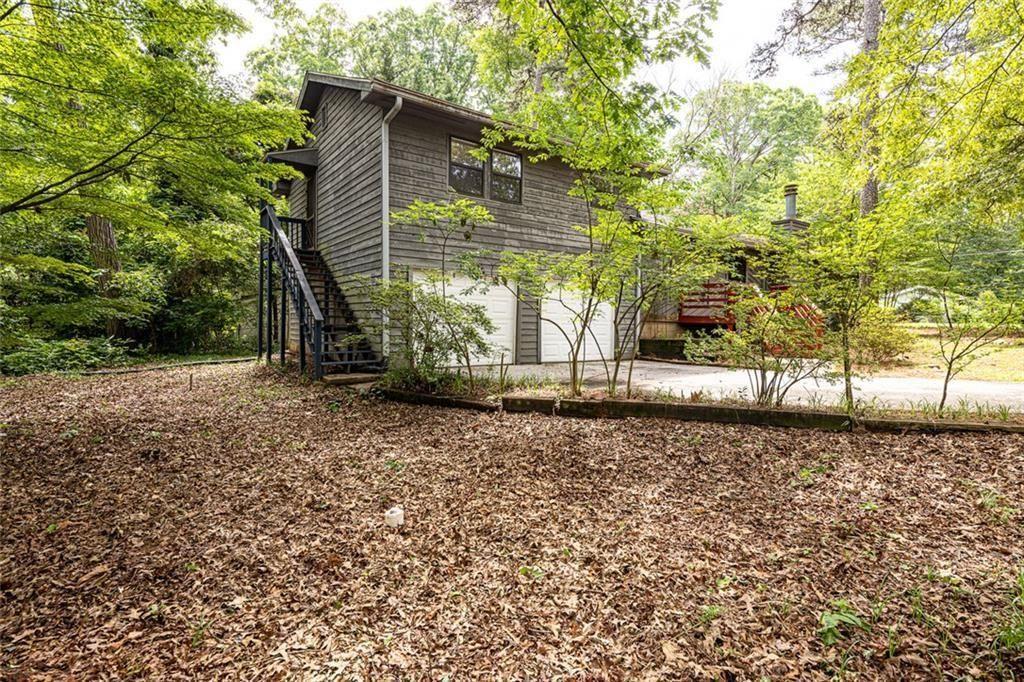 633 Iris Road Pine Lake, GA 30072 - Photo 8 of 39 a front view of a house with a yard