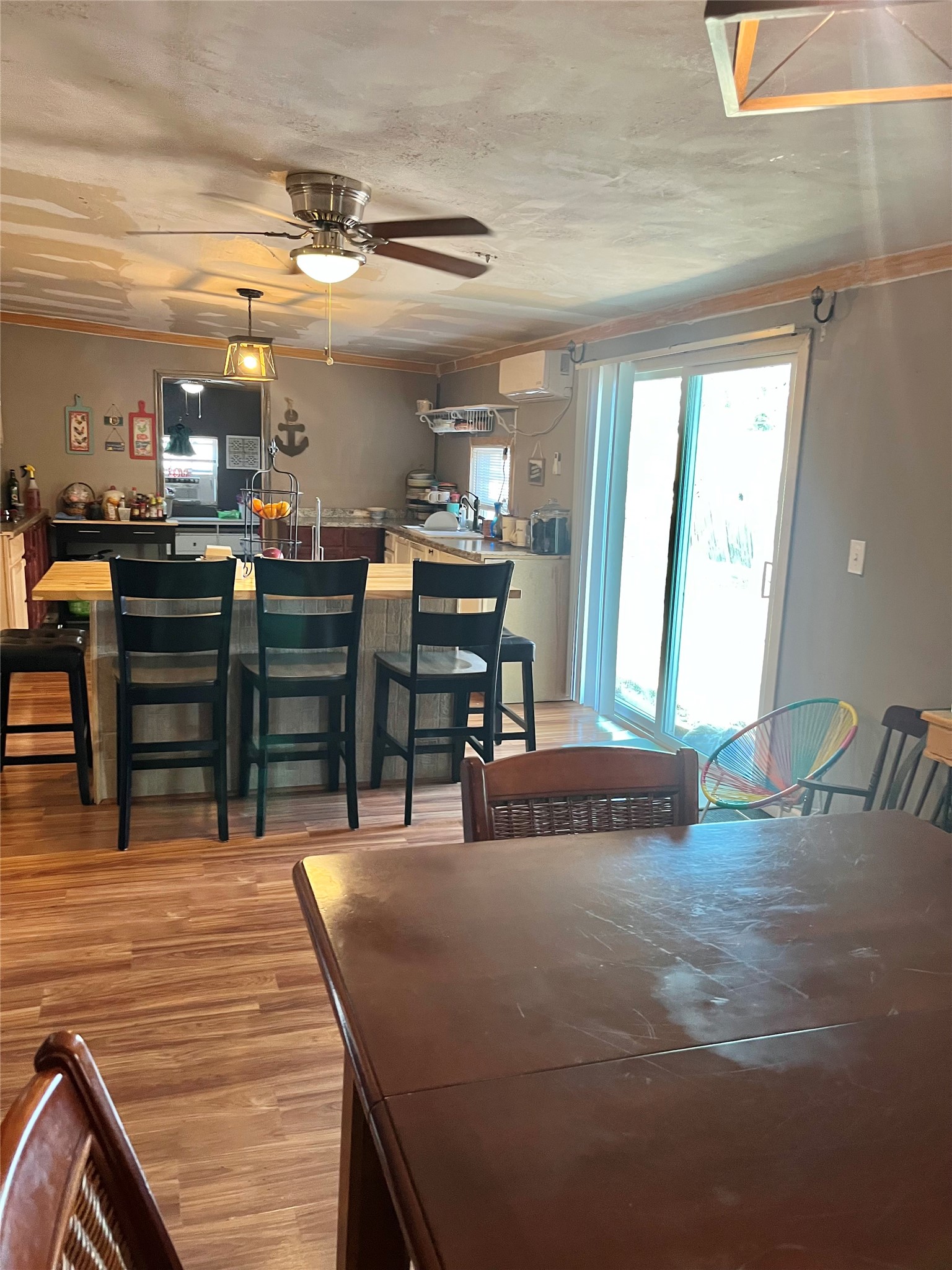 8026 Forest Trace Conroe, TX 77306 - Photo 11 of 28 a room with lots of wooden furniture and stainless steel appliances