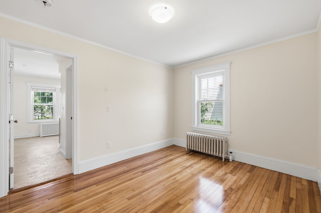 17 Rollinson Road Worcester, MA 01606 - Photo 16 of 41 an empty room with wooden floor and windows