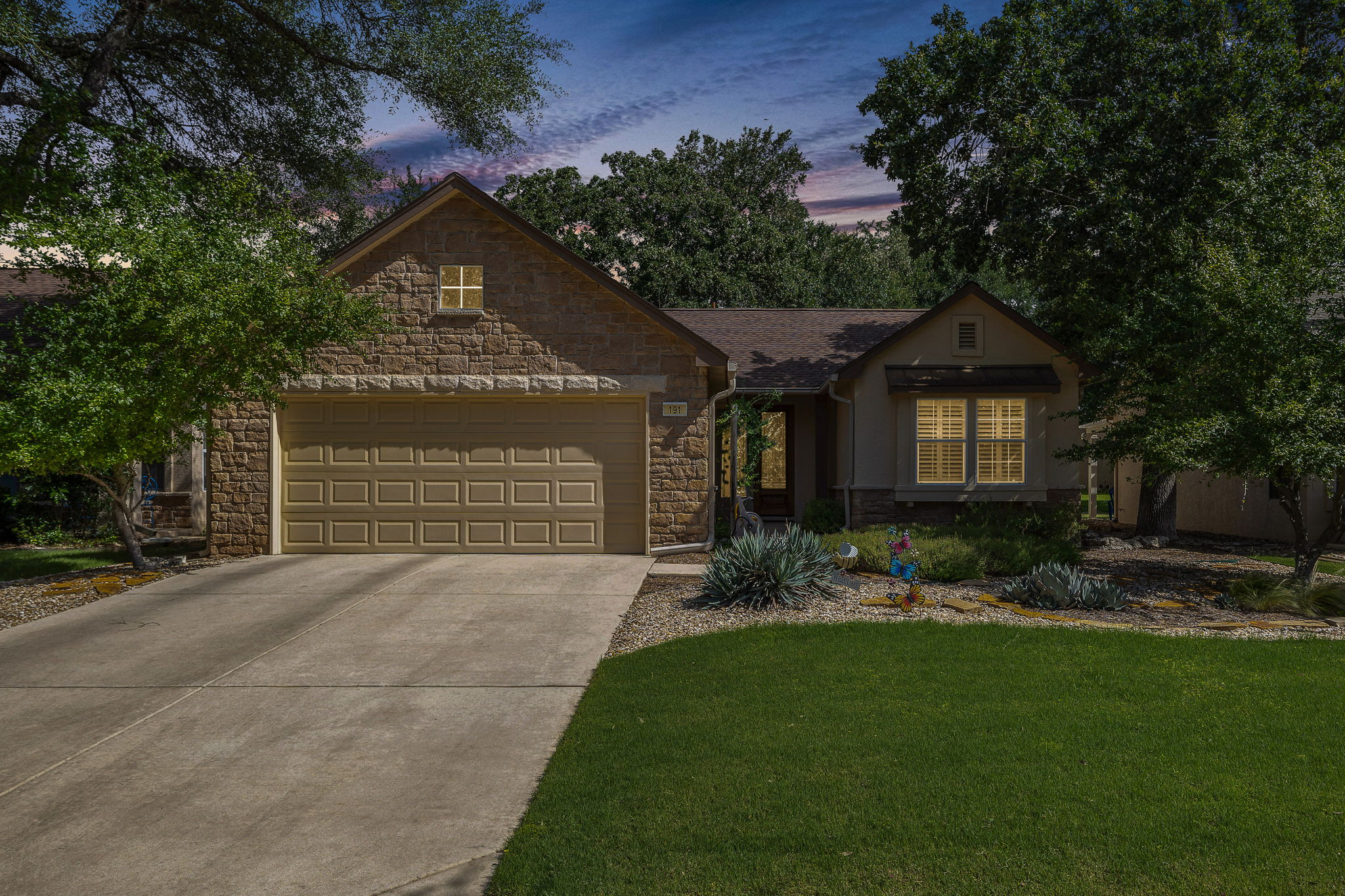 191 Trail Rider Way Georgetown, TX 78633 - Photo 24 of 25 A welcoming stone facade with an integrated garage and manicured landscaping enhances this charming residence.