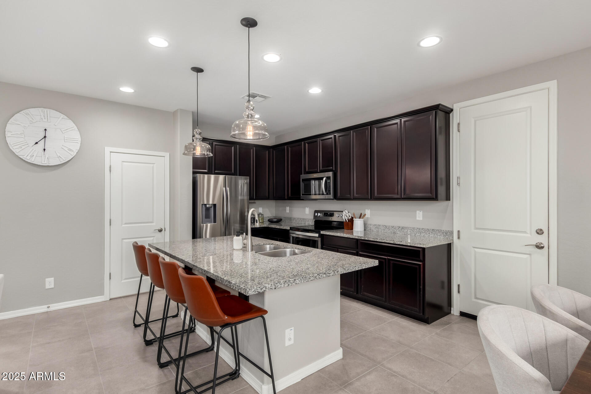 17160 North 9th Place Phoenix, AZ 85022 - Photo 11 of 46 a kitchen with stainless steel appliances granite countertop a sink a stove a refrigerator and a microwave