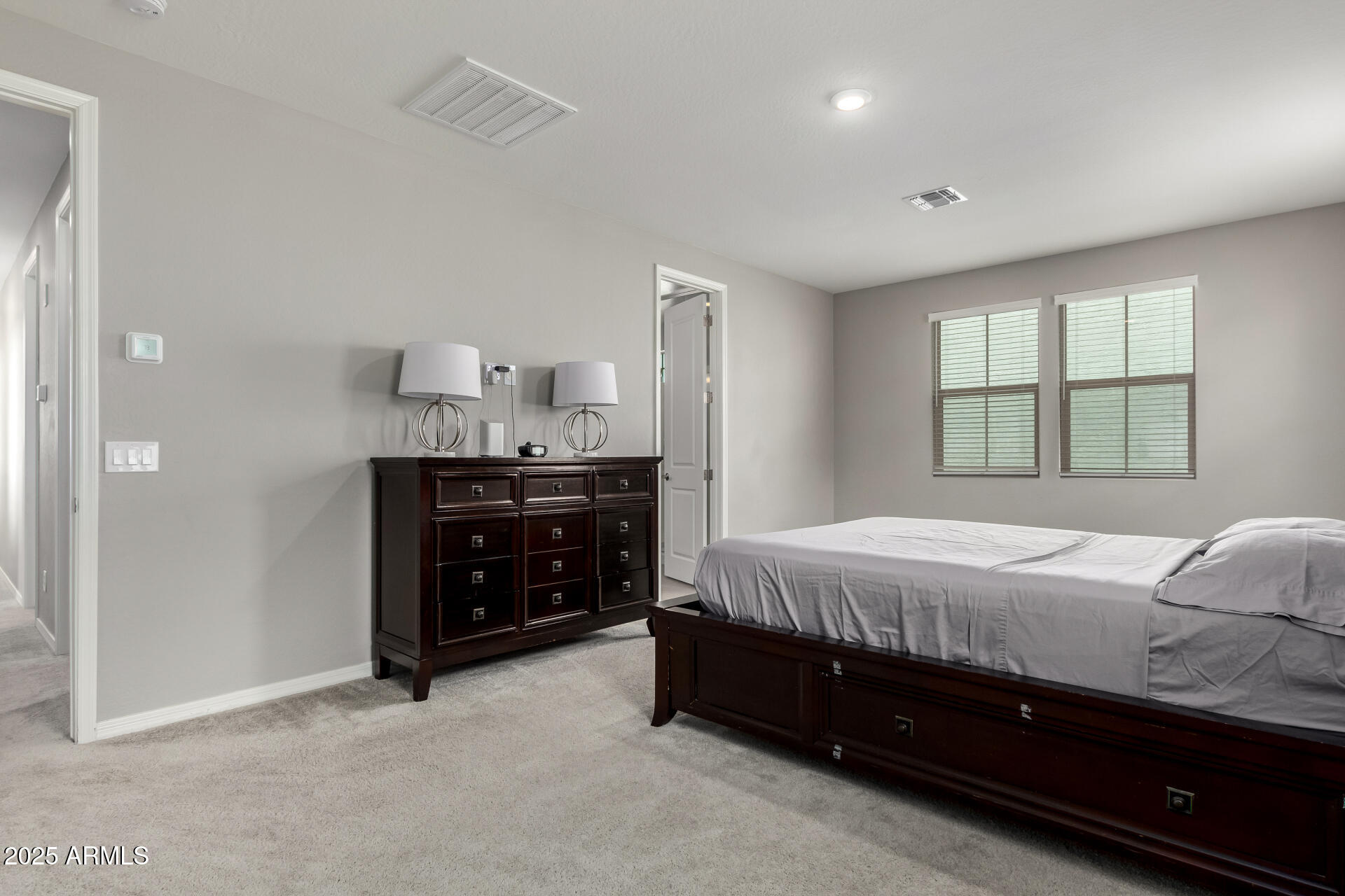 17160 North 9th Place Phoenix, AZ 85022 - Photo 18 of 46 a spacious bedroom with a bed and a cabinets