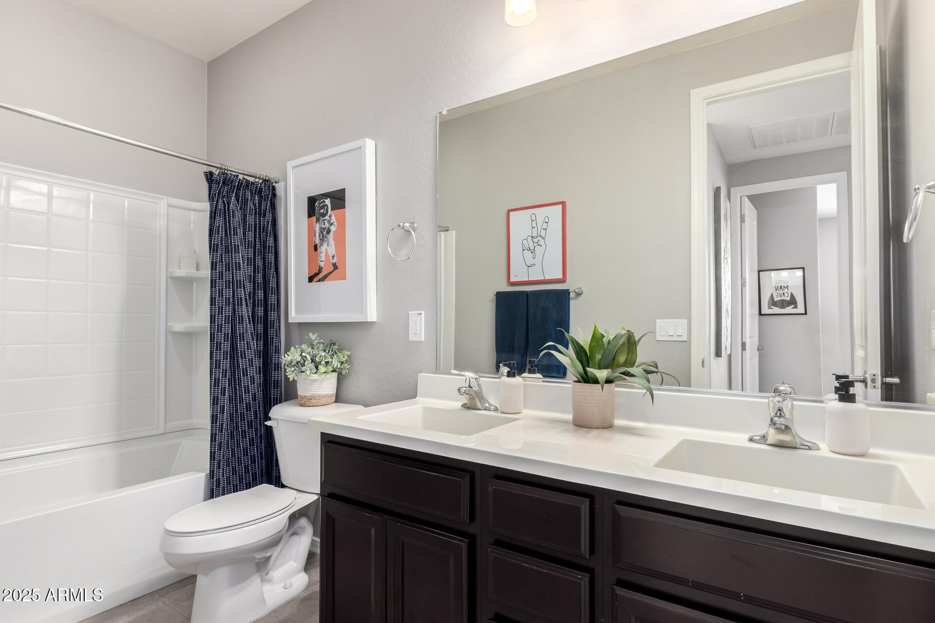 17160 North 9th Place Phoenix, AZ 85022 - Photo 29 of 46 a bathroom with a double vanity sink toilet and a mirror