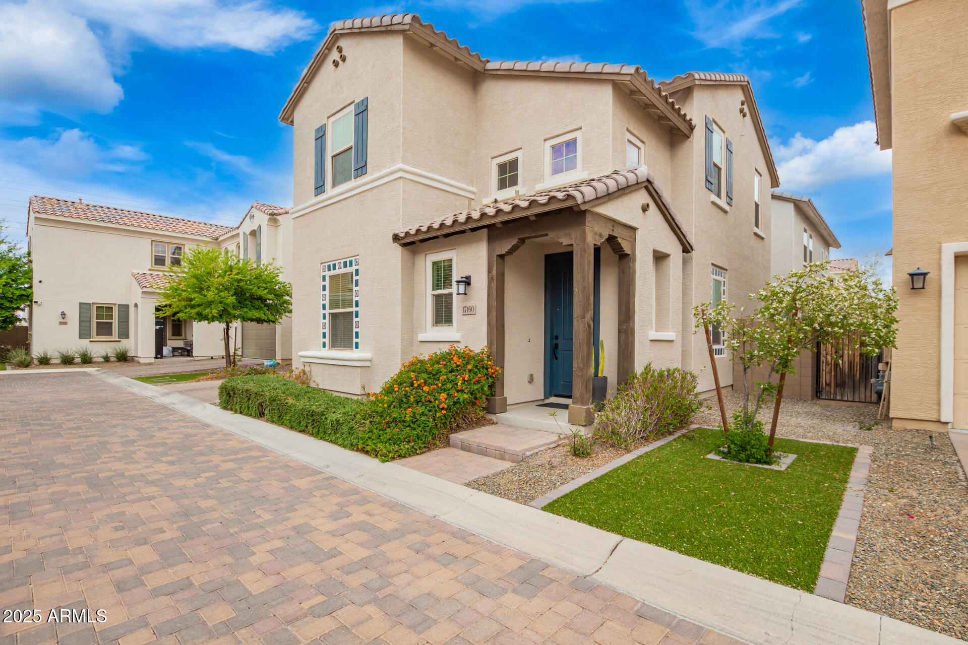 17160 North 9th Place Phoenix, AZ 85022 - Photo 3 of 46 a front view of a house with a yard and potted plants