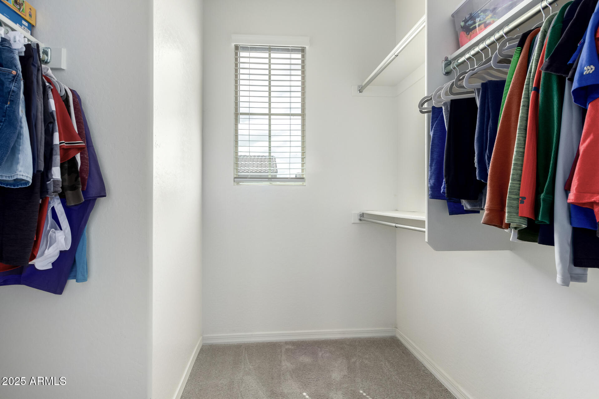 17160 North 9th Place Phoenix, AZ 85022 - Photo 31 of 46 a view of walk in closet with clothes