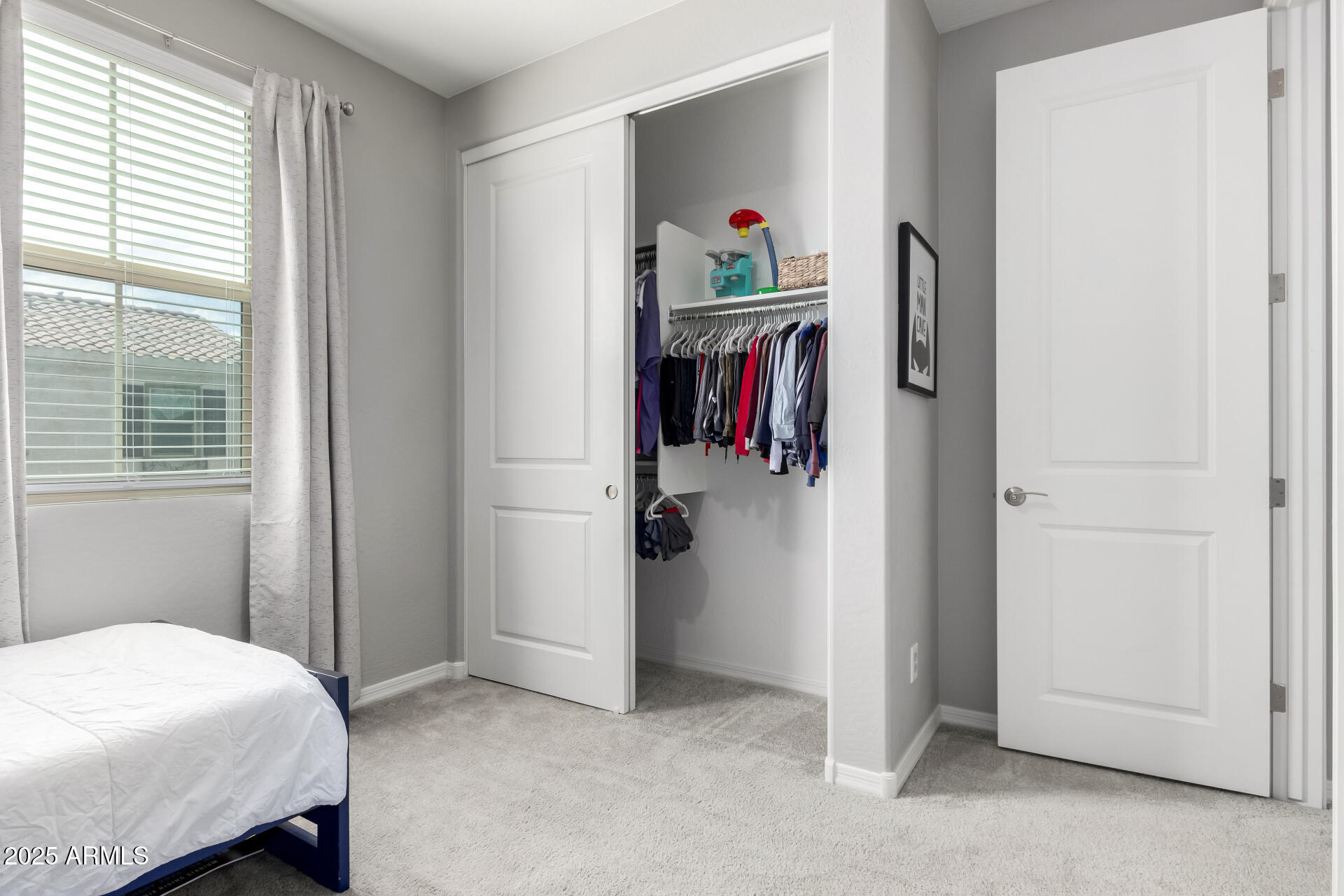 17160 North 9th Place Phoenix, AZ 85022 - Photo 33 of 46 a bedroom with a bed and a closet