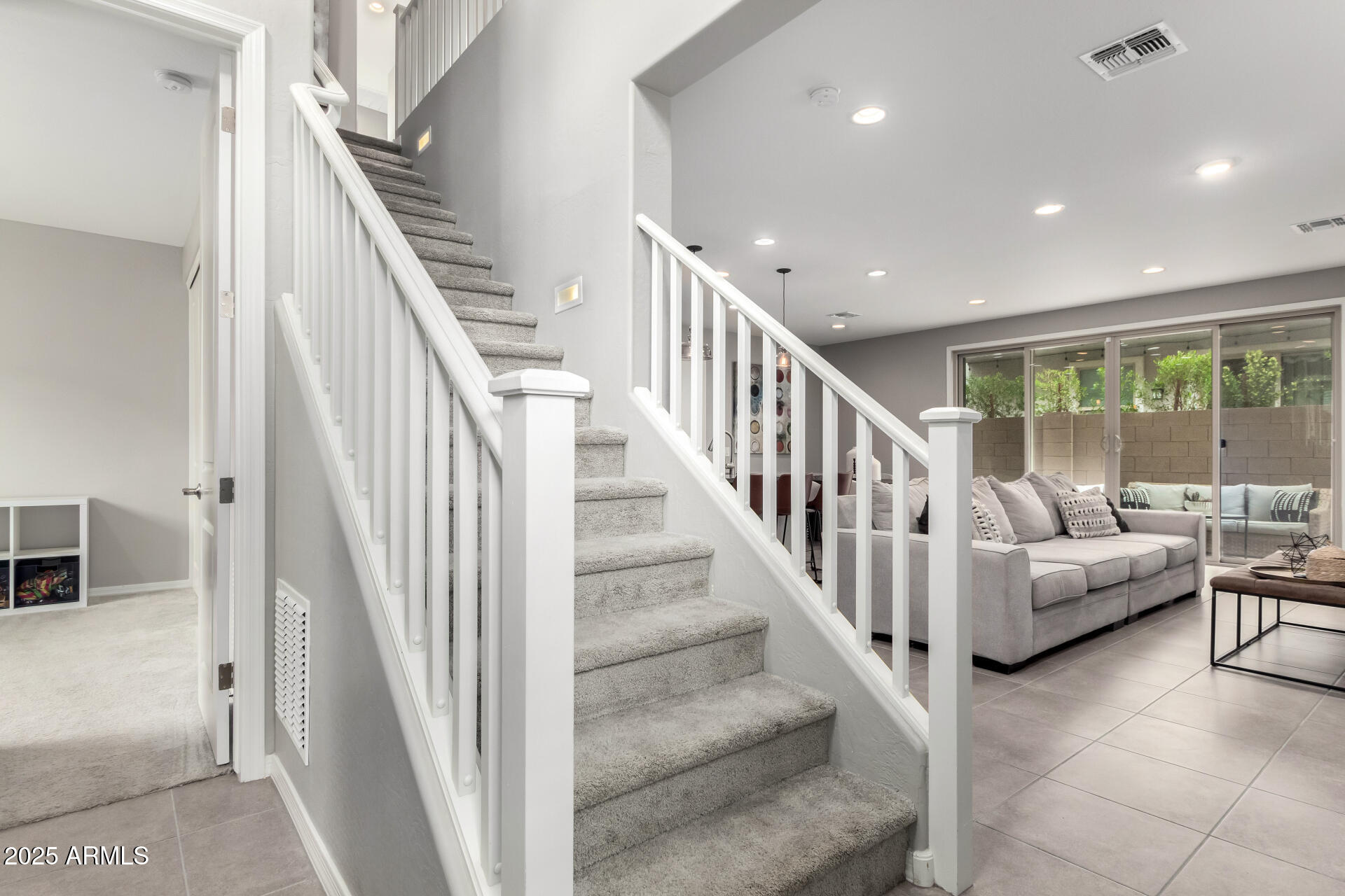 17160 North 9th Place Phoenix, AZ 85022 - Photo 35 of 46 a view of staircase with living room and white walls