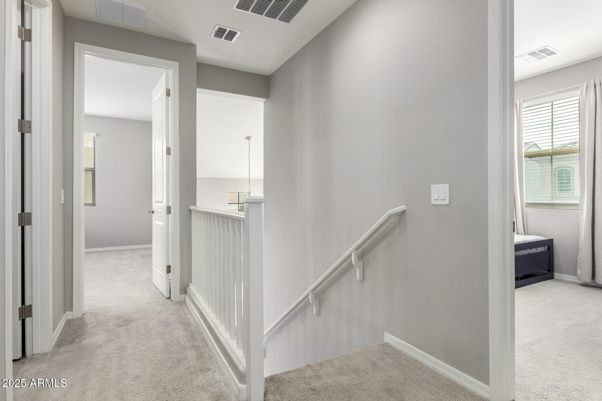 17160 North 9th Place Phoenix, AZ 85022 - Photo 37 of 46 a view of a hallway with wooden floor and a bathroom