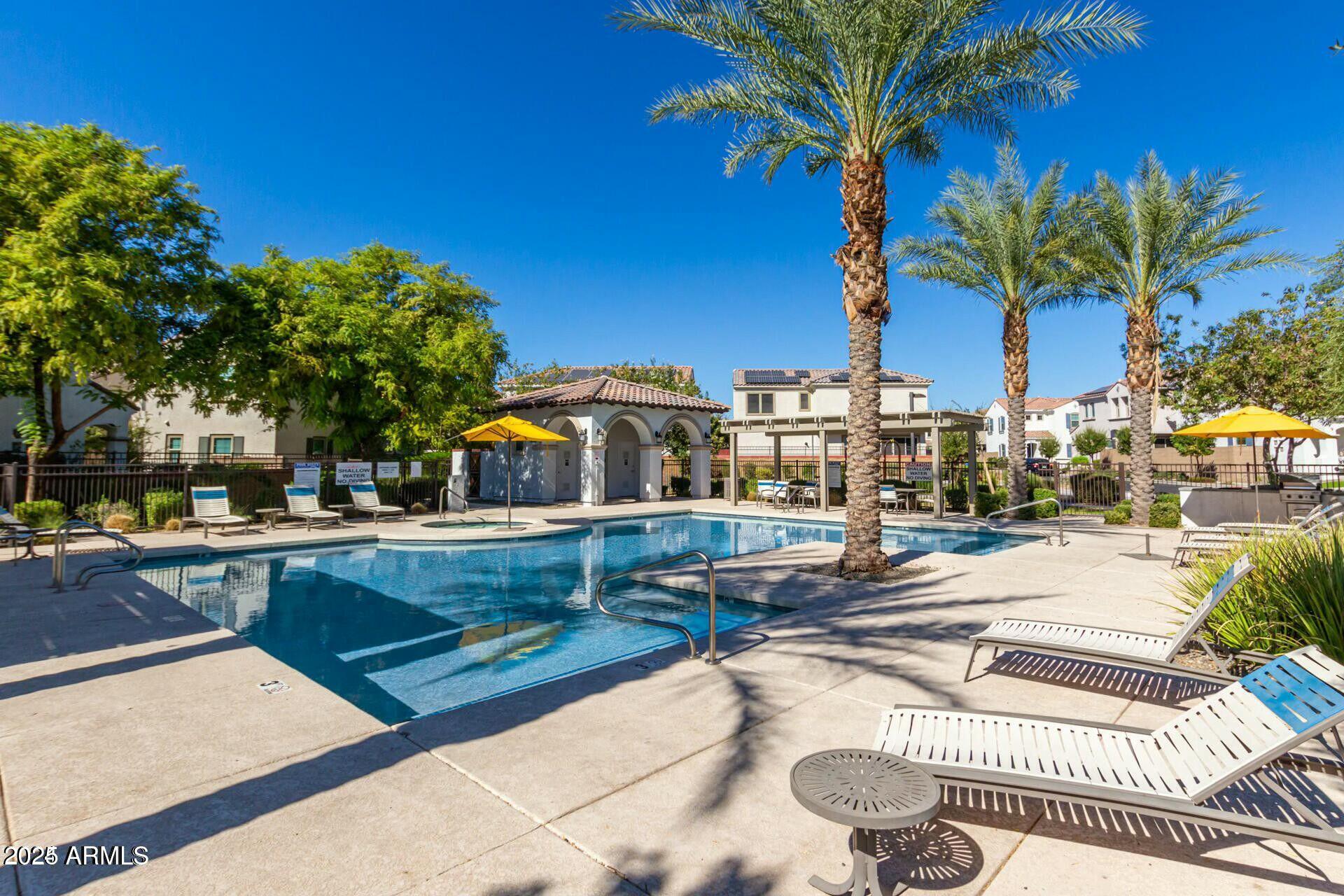 17160 North 9th Place Phoenix, AZ 85022 - Photo 38 of 46 a view of a swimming pool with couches chairs and a table