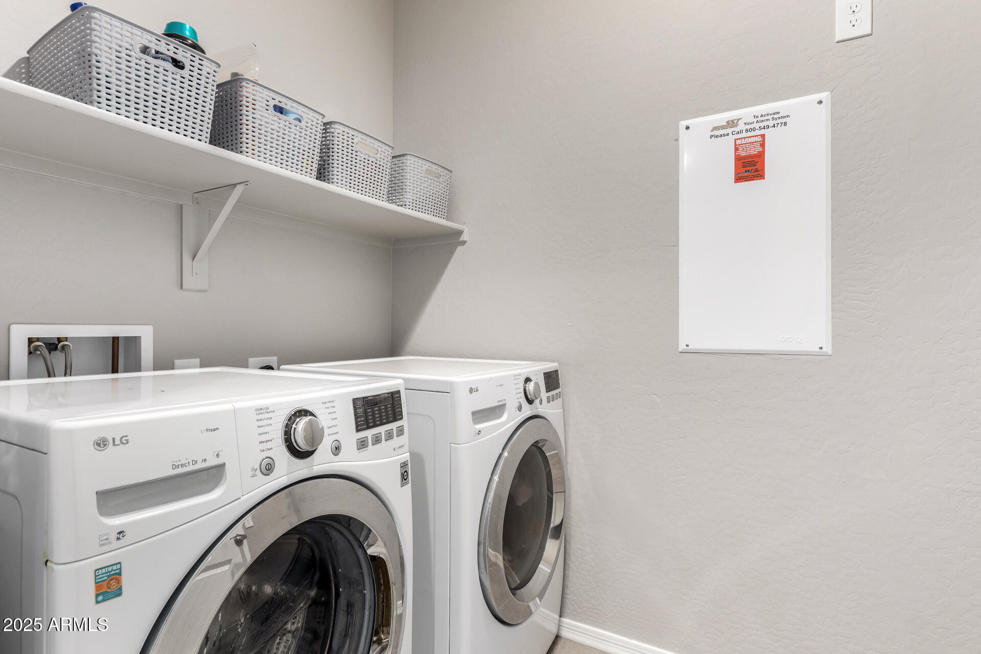 17160 North 9th Place Phoenix, AZ 85022 - Photo 39 of 46 a view of washer and dryer with kitchen in the background
