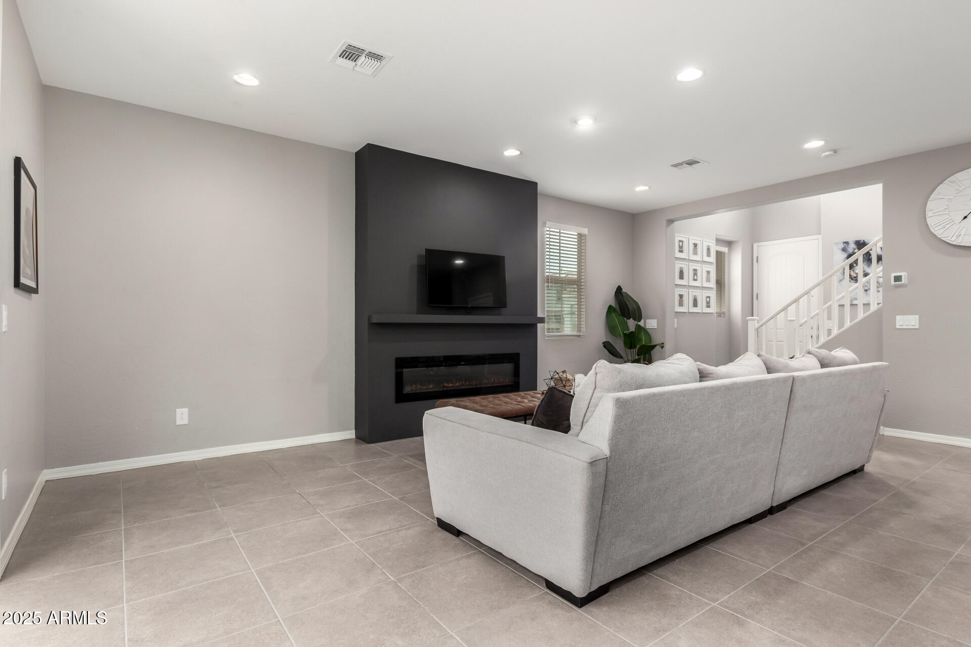 17160 North 9th Place Phoenix, AZ 85022 - Photo 5 of 46 a living room with furniture and a flat screen tv