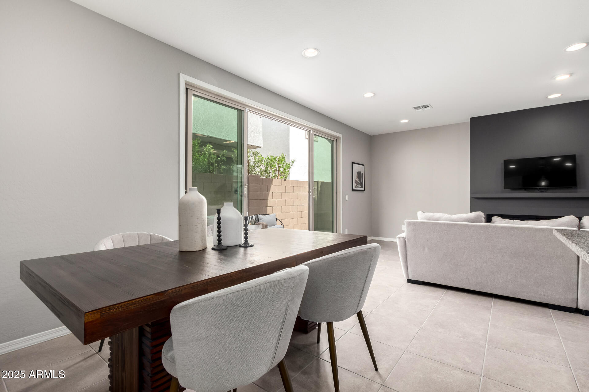 17160 North 9th Place Phoenix, AZ 85022 - Photo 9 of 46 a living room with furniture a flat screen tv and a large window