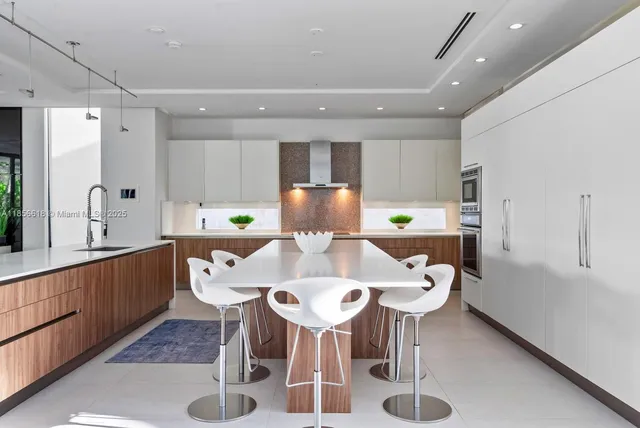 a living room with furniture flowers and a chandelier