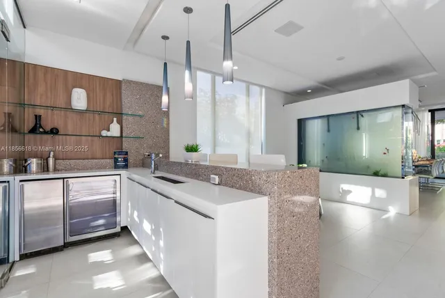 a living room with a couch and a book shelf