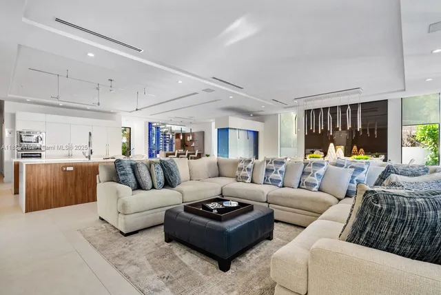 a spacious bedroom with a bed and a couch