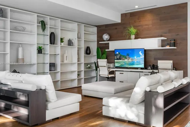 a bathroom with a granite countertop sink toilet and mirror