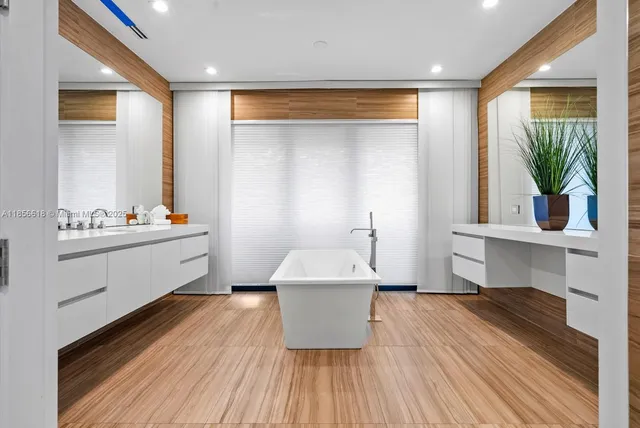 a bedroom with a large bed and a couch