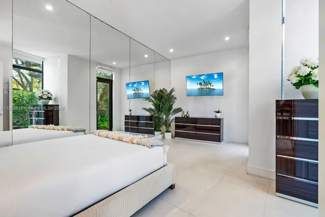 a bathroom with a granite countertop sink toilet and mirror