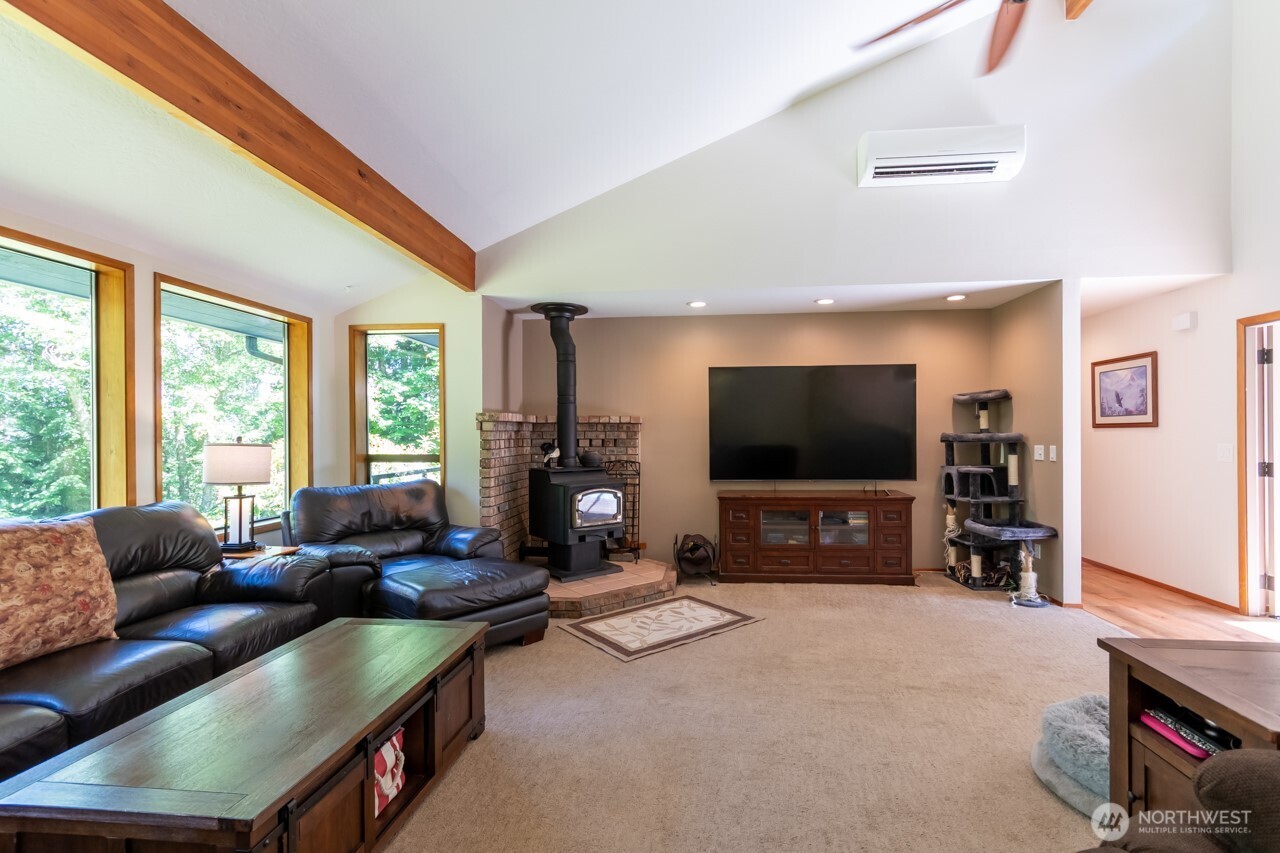 492 Walkabout Way Port Angeles, WA 98363 - Photo 19 of 40 a living room with furniture and a flat screen tv