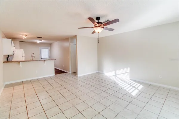 a view of a kitchen with a sink and a window