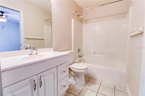 a bathroom with a sink toilet a mirror and shower
